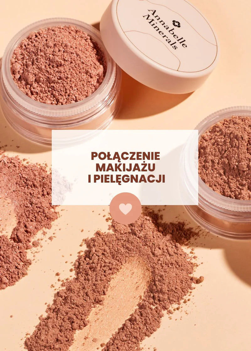 Przezroczyste pojemniki z różem mineralnym Annabelle Minerals rozsypanym na blacie